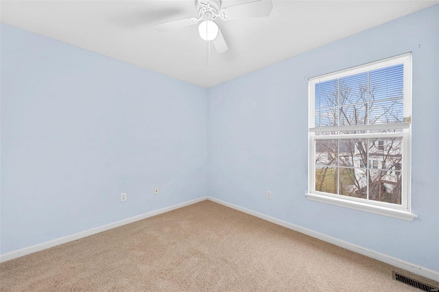 carpeted empty room with ceiling fan