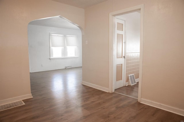 hallway with dark wood-type flooring