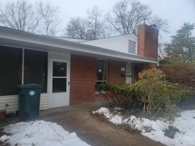 view of snow covered property entrance