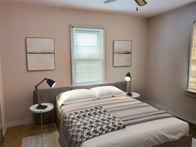 bedroom featuring hardwood / wood-style floors and ceiling fan