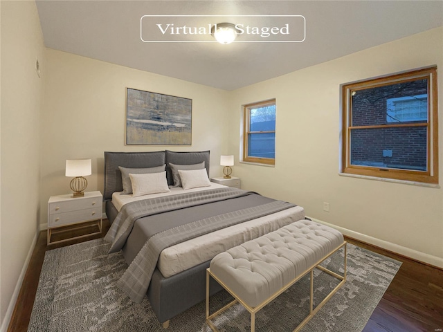 bedroom featuring dark wood-type flooring