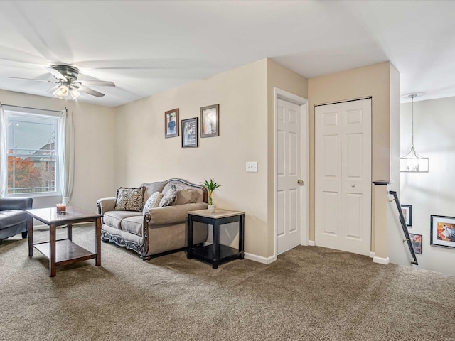 carpeted living room featuring ceiling fan