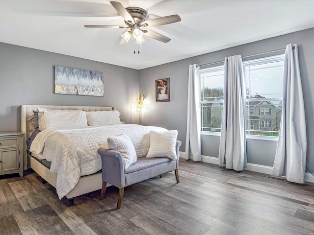 bedroom featuring ceiling fan and dark hardwood / wood-style flooring