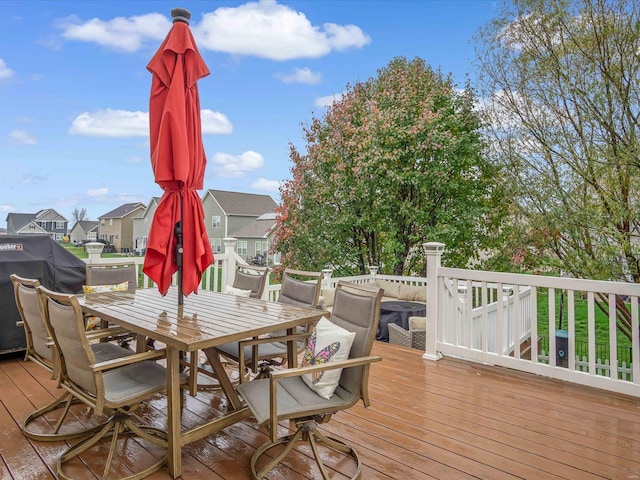 wooden terrace featuring area for grilling