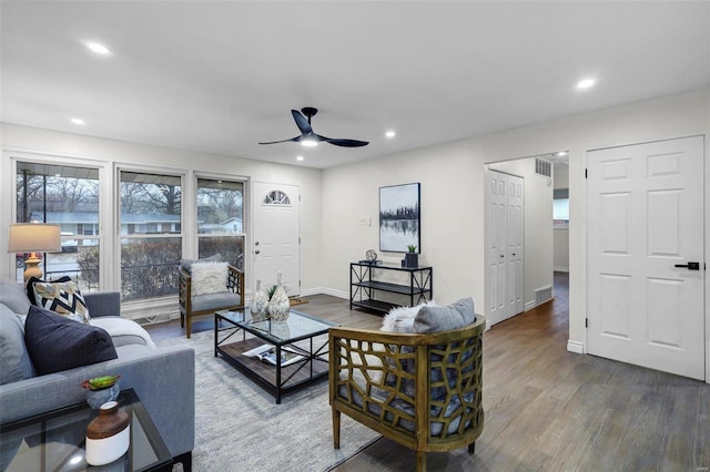 living room with hardwood / wood-style floors and ceiling fan