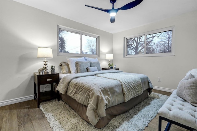 bedroom featuring hardwood / wood-style floors and ceiling fan