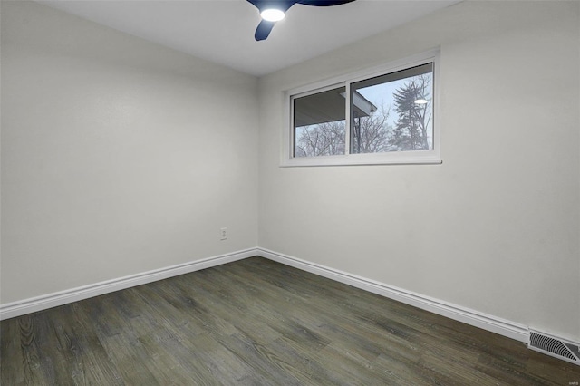 unfurnished room featuring ceiling fan and dark hardwood / wood-style flooring