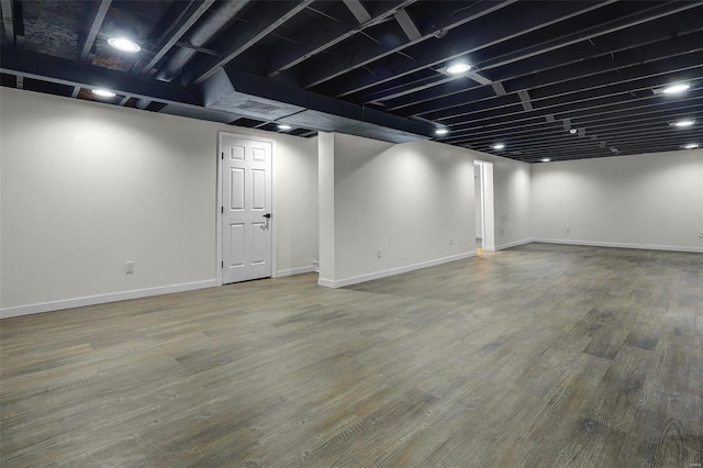 basement featuring wood-type flooring