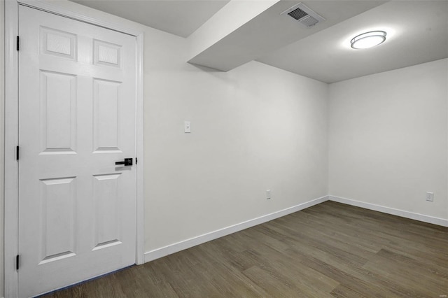 empty room featuring dark wood-type flooring