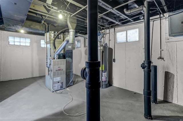 basement featuring heating unit and electric panel