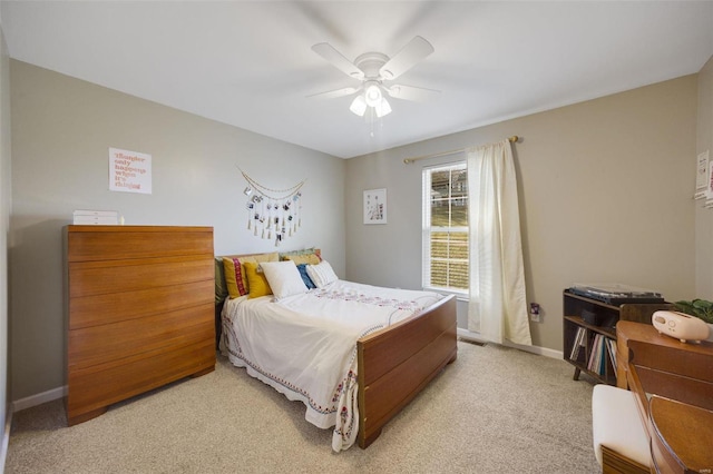 bedroom featuring ceiling fan and light colored carpet