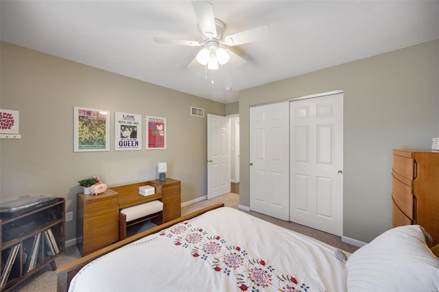 bedroom with ceiling fan, carpet floors, and a closet