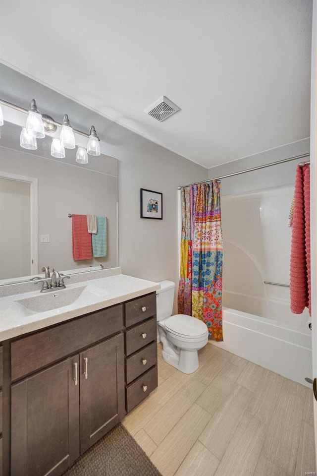 full bathroom with vanity, toilet, and shower / bath combo