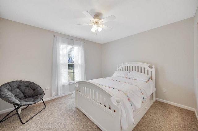 bedroom featuring light colored carpet and ceiling fan