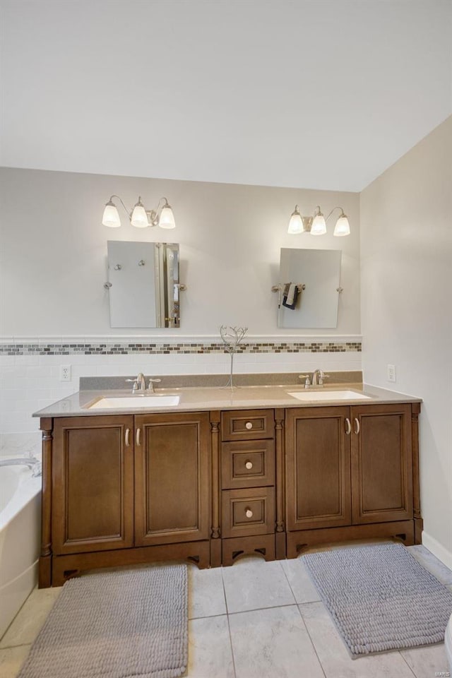 bathroom with vanity and a bath