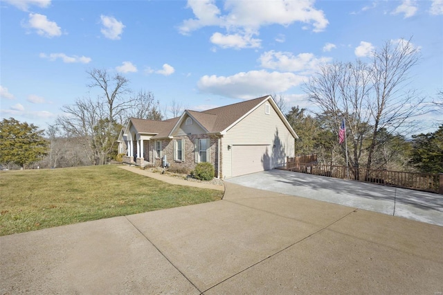 view of front of house featuring a garage and a front yard