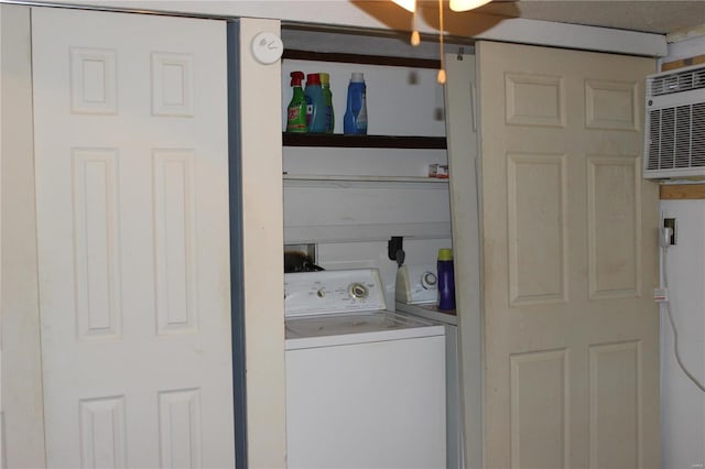 clothes washing area featuring ceiling fan and washer / clothes dryer