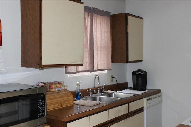 kitchen with dishwasher and sink