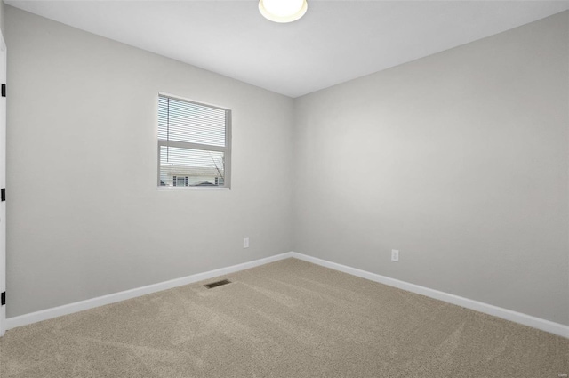 spare room with carpet floors