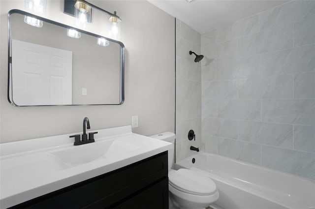 full bathroom with vanity, toilet, and tiled shower / bath combo