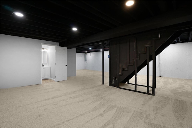 basement with light colored carpet