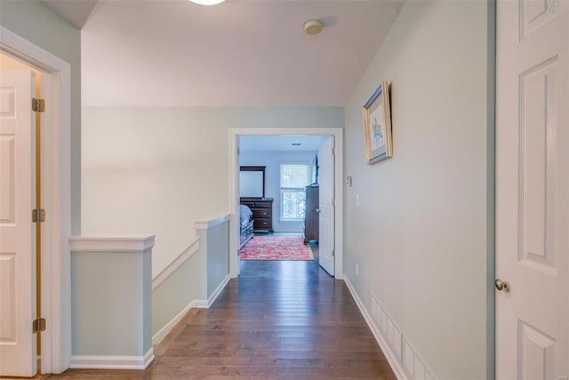 corridor featuring dark hardwood / wood-style floors