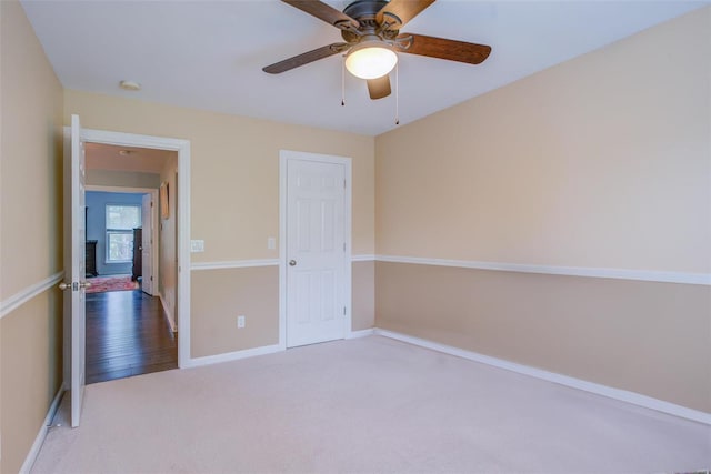 unfurnished bedroom with carpet floors and ceiling fan