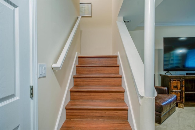 staircase featuring wood-type flooring