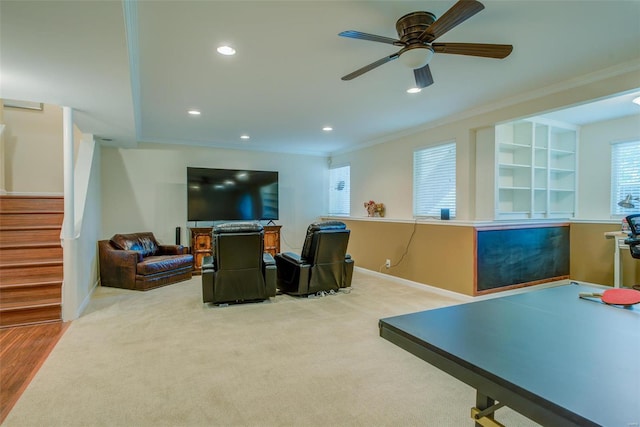 game room featuring ceiling fan, ornamental molding, and carpet