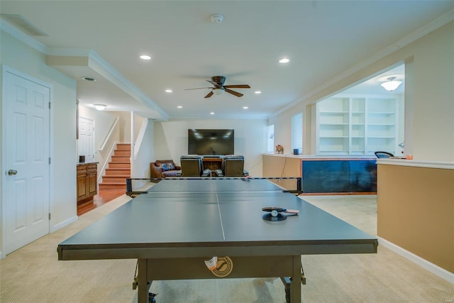 playroom with crown molding, light colored carpet, and built in features