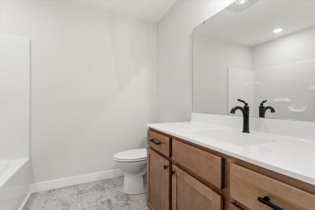 full bath with toilet,  shower combination, vanity, and baseboards