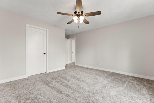 unfurnished bedroom featuring ceiling fan, carpet flooring, and baseboards