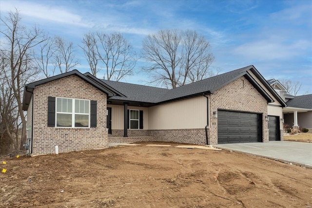 single story home with an attached garage, a shingled roof, concrete driveway, and brick siding