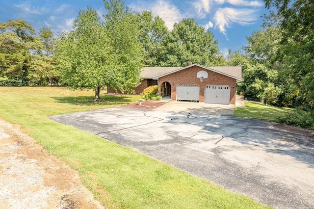 view of front of house with a garage and a front yard