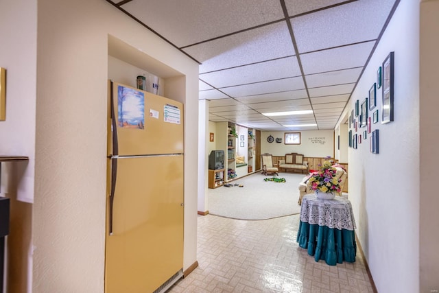 corridor featuring a paneled ceiling