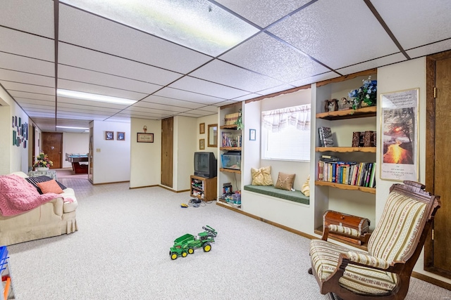 recreation room with carpet flooring and a paneled ceiling