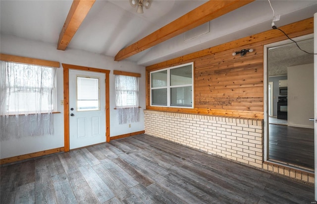 unfurnished sunroom featuring a wealth of natural light and beam ceiling