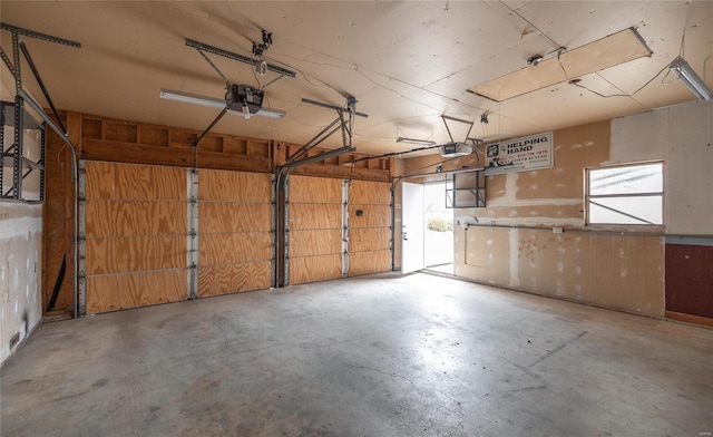 garage featuring a garage door opener