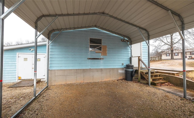 view of home's exterior with a detached carport