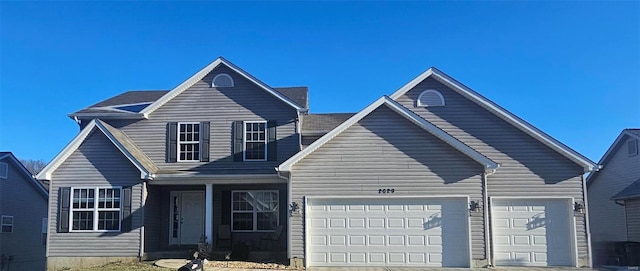 front of property with a garage