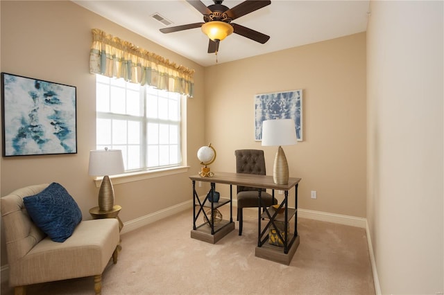 home office featuring ceiling fan and light colored carpet