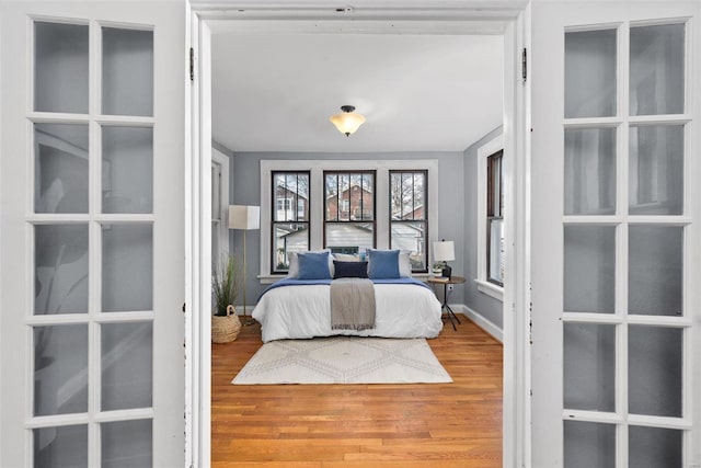 bedroom with hardwood / wood-style flooring