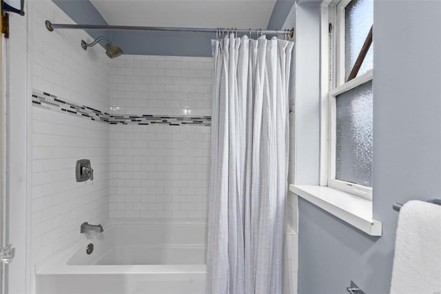 bathroom with shower / bath combination with curtain