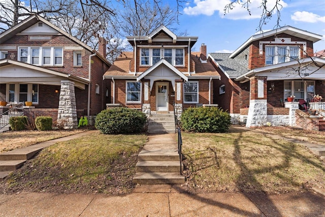 craftsman-style home with a front yard