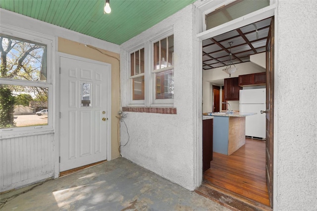 doorway to property with stucco siding