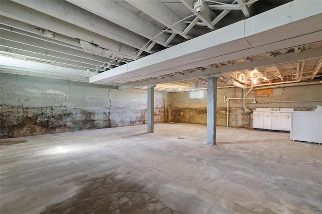 below grade area featuring washer / clothes dryer