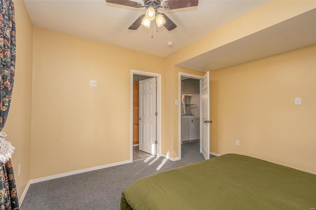 unfurnished bedroom with dark carpet, washer and clothes dryer, and ceiling fan