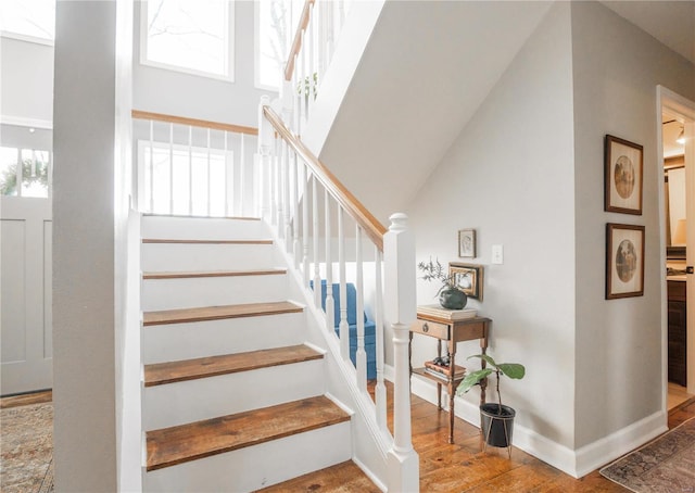 stairway featuring wood-type flooring