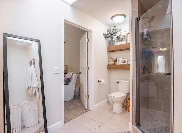 bathroom with tile patterned flooring, walk in shower, and toilet