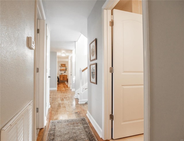 hallway featuring light hardwood / wood-style flooring